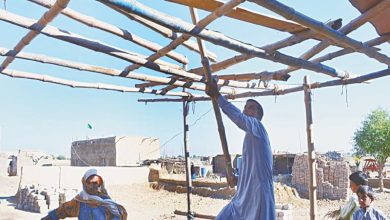 BAJARA A flood affected family reconstructing their house in UC Bajara.—Photos by Umair Ali